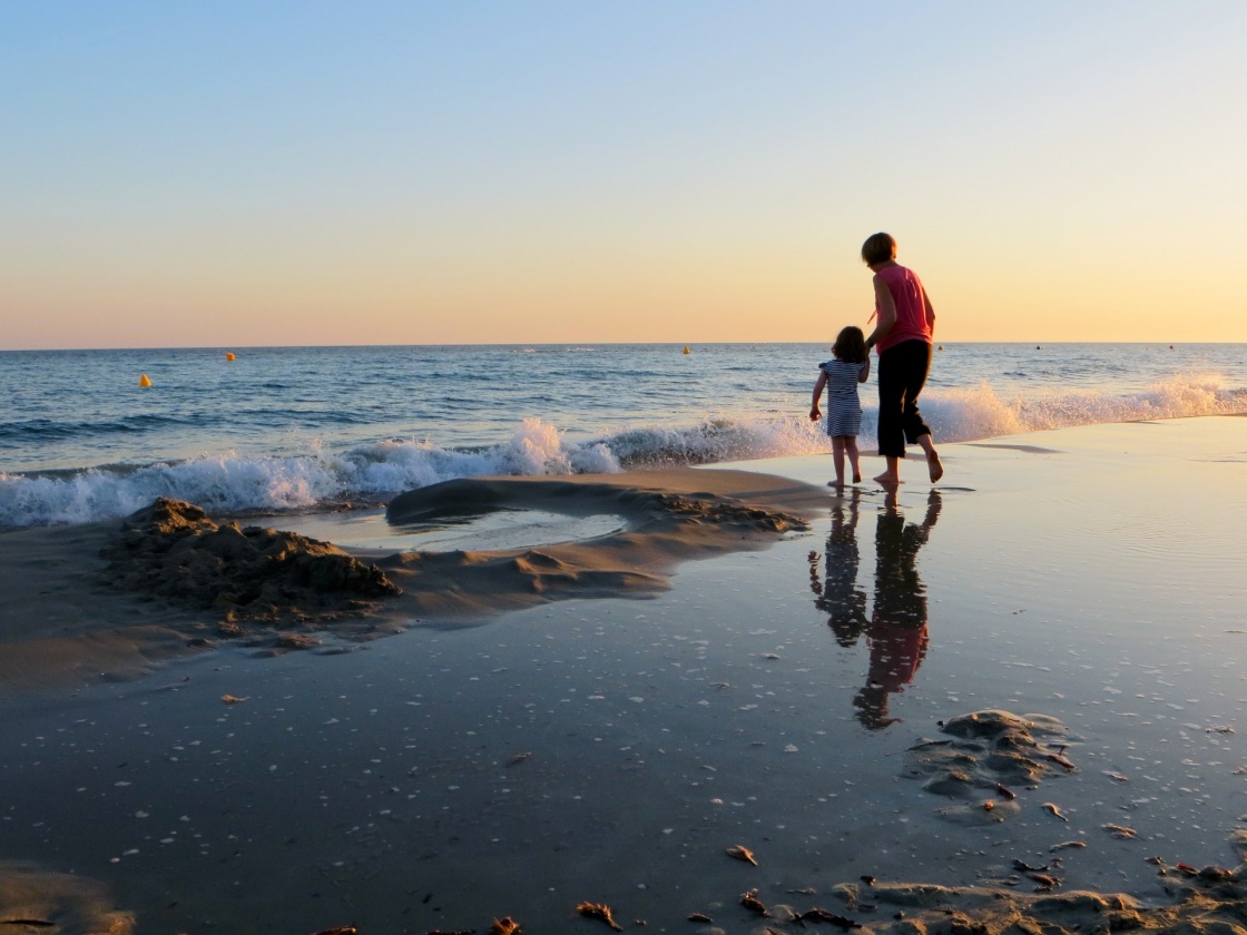 'Waves crashing on the shore, with mother and child, Menorca' - Menorca